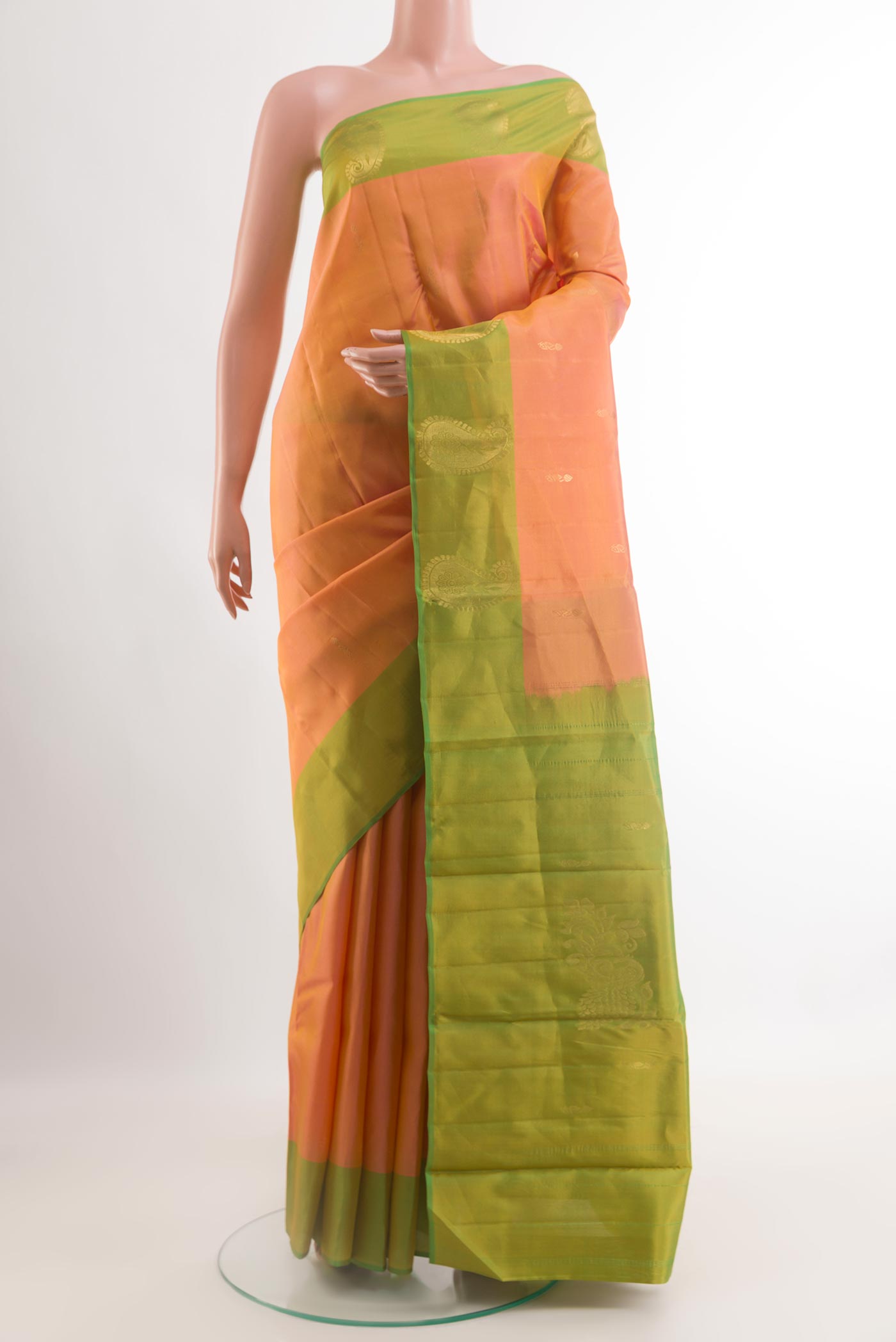 Orange Kanchipuram Silk Saree with Zari Butta on the body and Zari Border.  displayed on a mannequin