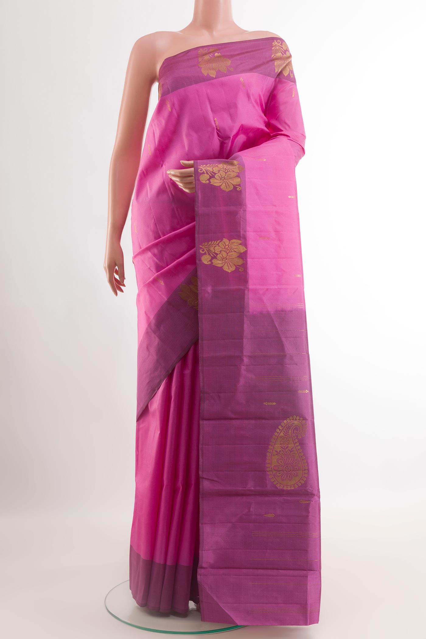 Pink Kanchipuram Silk Saree with Zari Butta on the body and Zari Border.  displayed on a mannequin