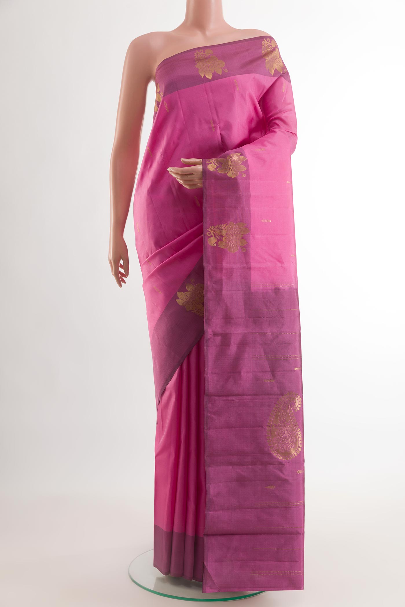 Pink Kanchipuram Silk Saree with Zari Butta on the body and Zari Border.  displayed on a mannequin
