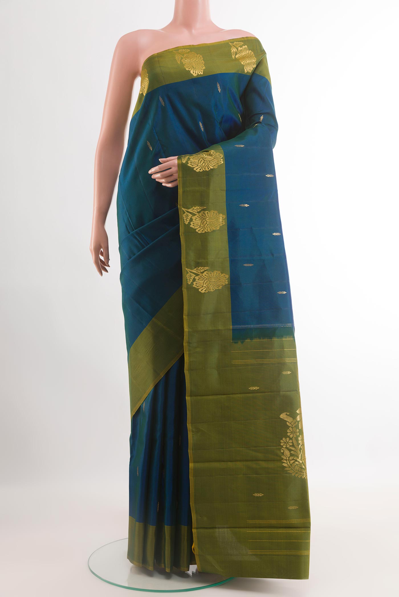 Blue Kanchipuram Silk Saree with Zari Butta on the body and Zari Border.  displayed on a mannequin