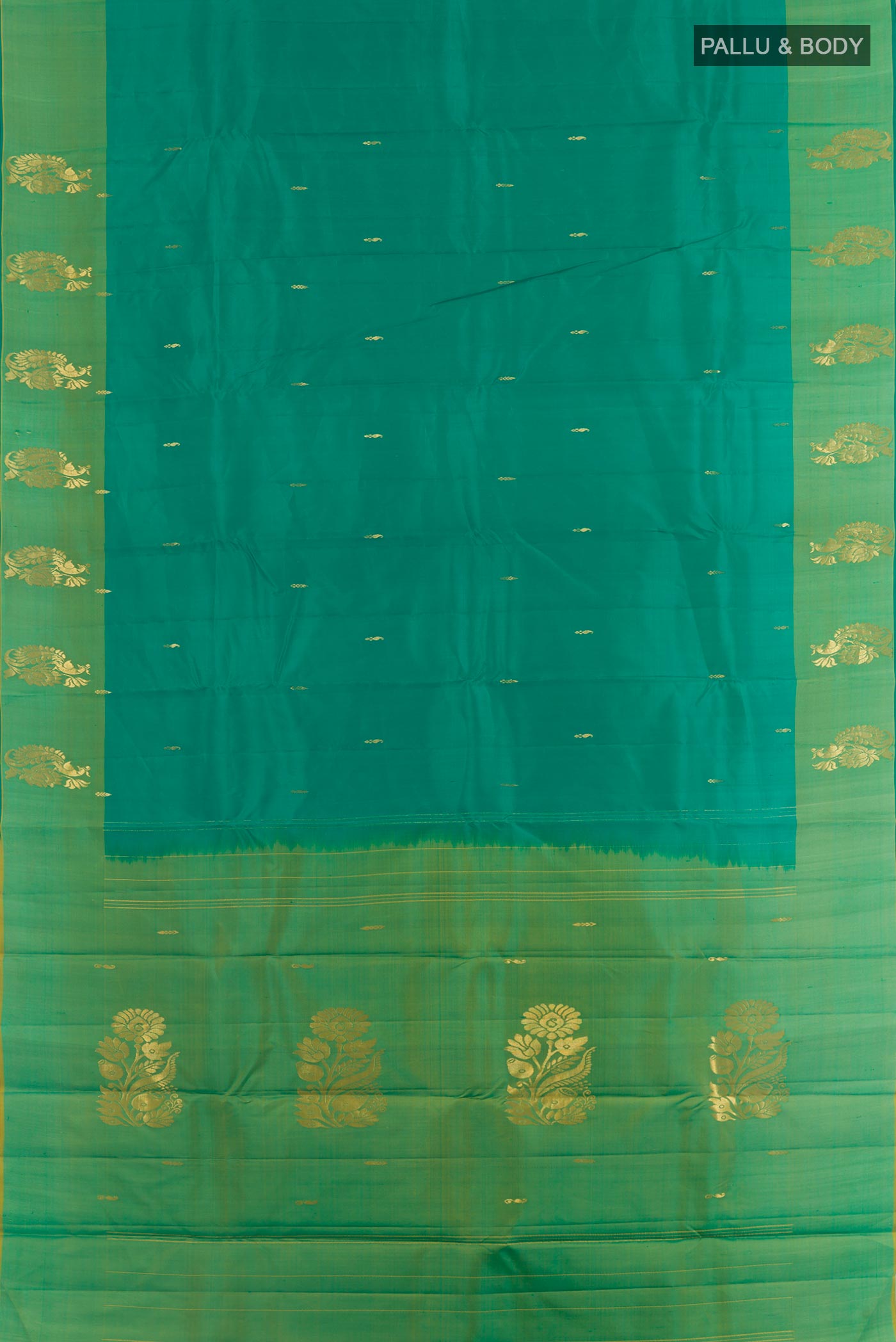 Flat view of Green Kanchipuram Silk Saree with Zari Butta on the body and Zari Border. 