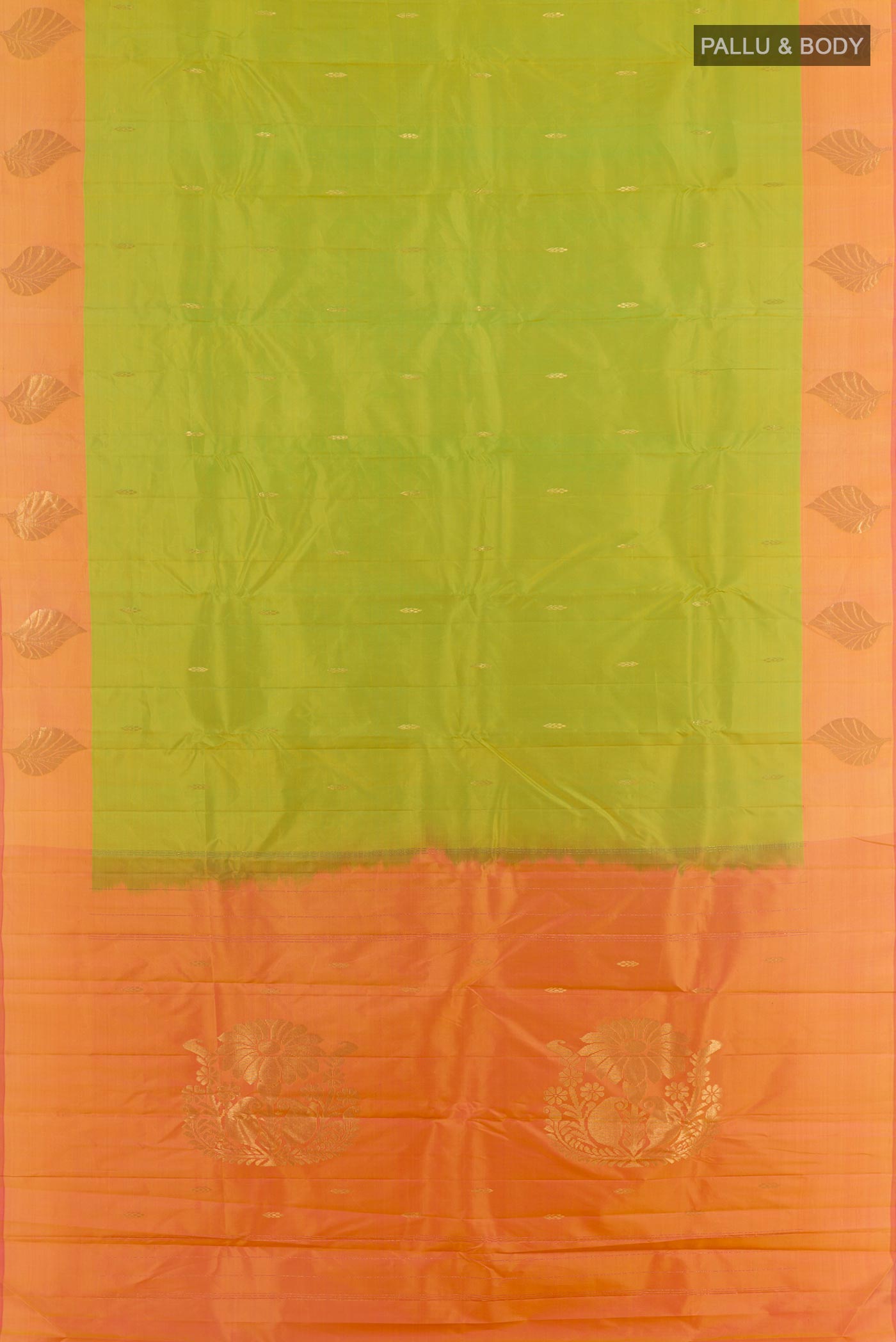 Flat view of Green Kanchipuram Silk Saree with Zari Butta on the body and Zari Border. 