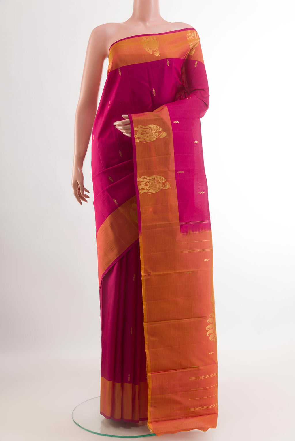 Purple Kanchipuram Silk Saree with Zari Butta on the body and Zari Border.  displayed on a mannequin