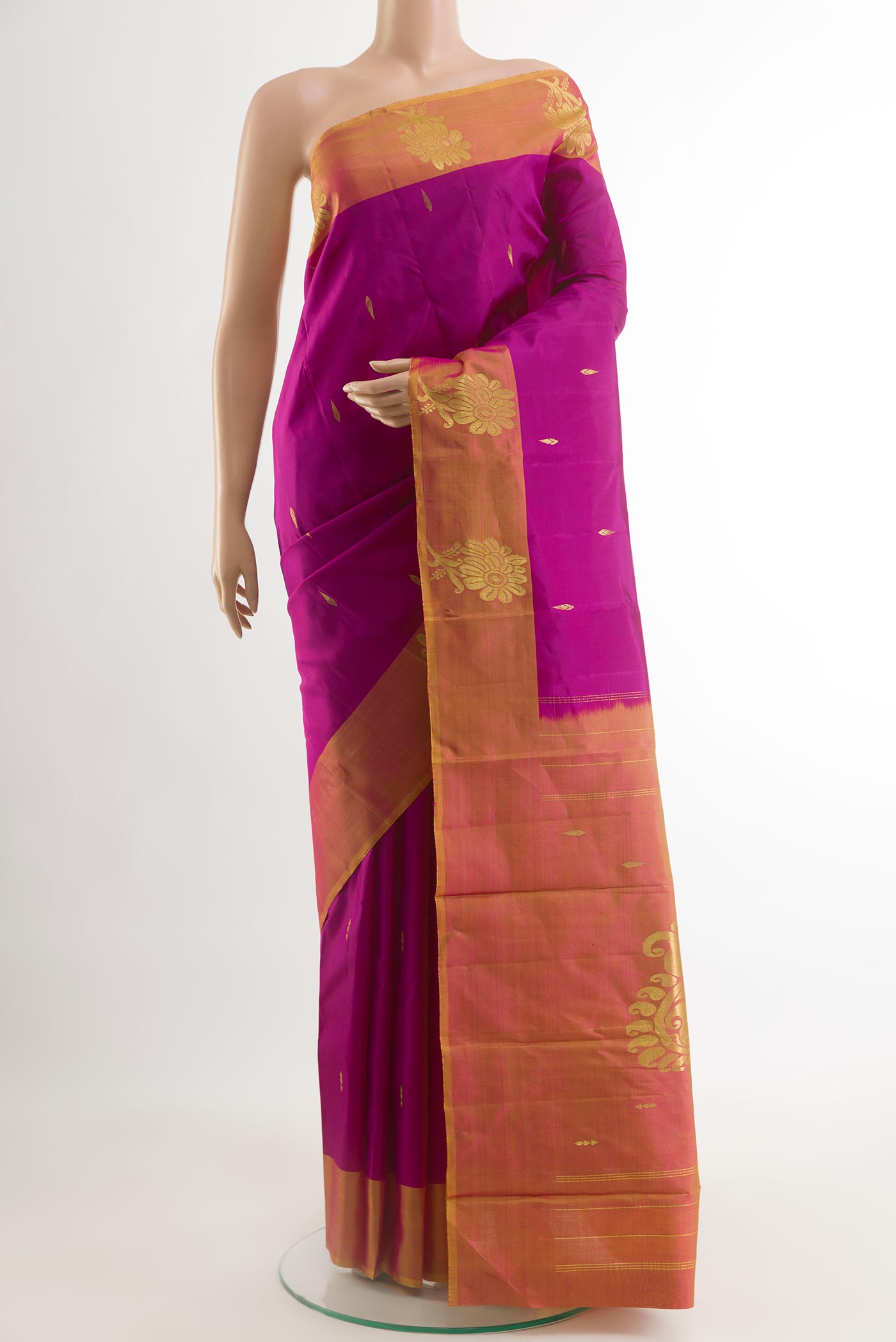 Purple Kanchipuram Silk Saree with Zari Butta on the body and Zari Border.  displayed on a mannequin