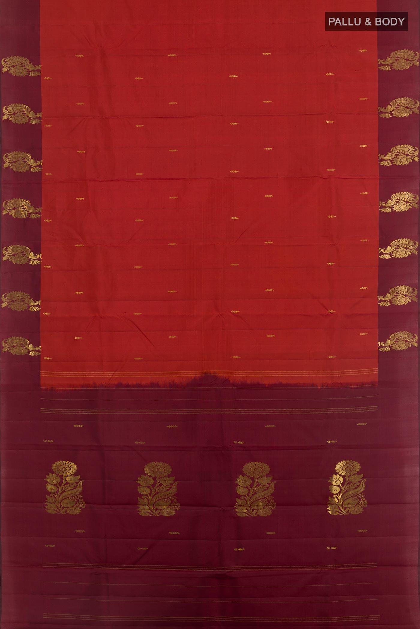 Flat view of Rust Kanchipuram Silk Saree with Zari Butta on the body and Zari Border. 
