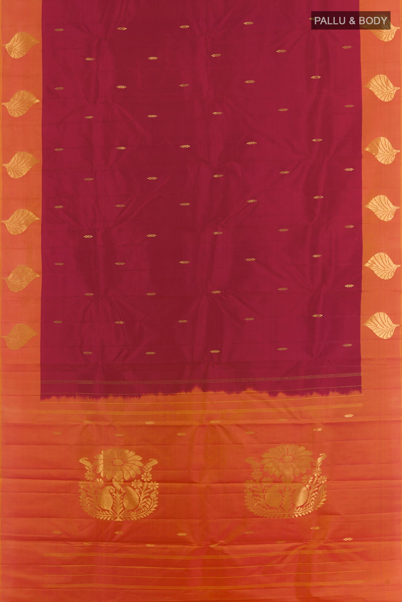 Flat view of Maroon Kanchipuram Silk Saree with Zari Butta on the body and Zari Border. 
