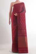 Pure Silk Maroon Kanchipuram Saree with Zari Butta on the body and Zari Border.  displayed on a mannequin