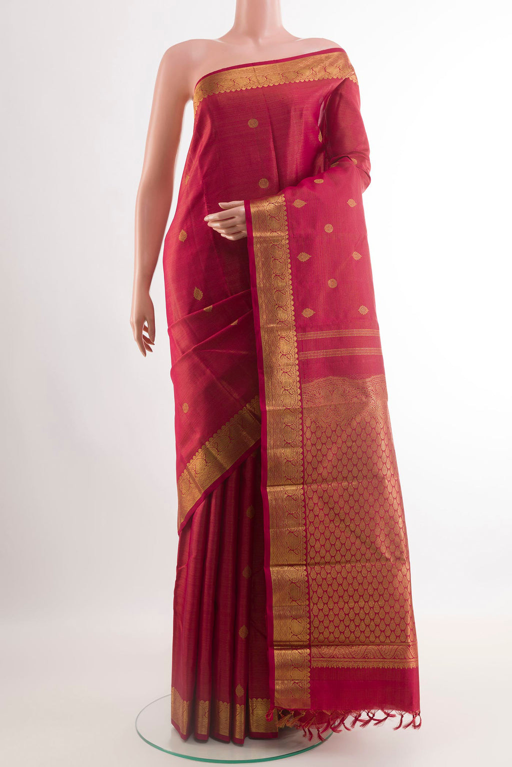 Maroon Kanchipuram Silk Saree with Zari Brocade on the body and Zari Border.  displayed on a mannequin