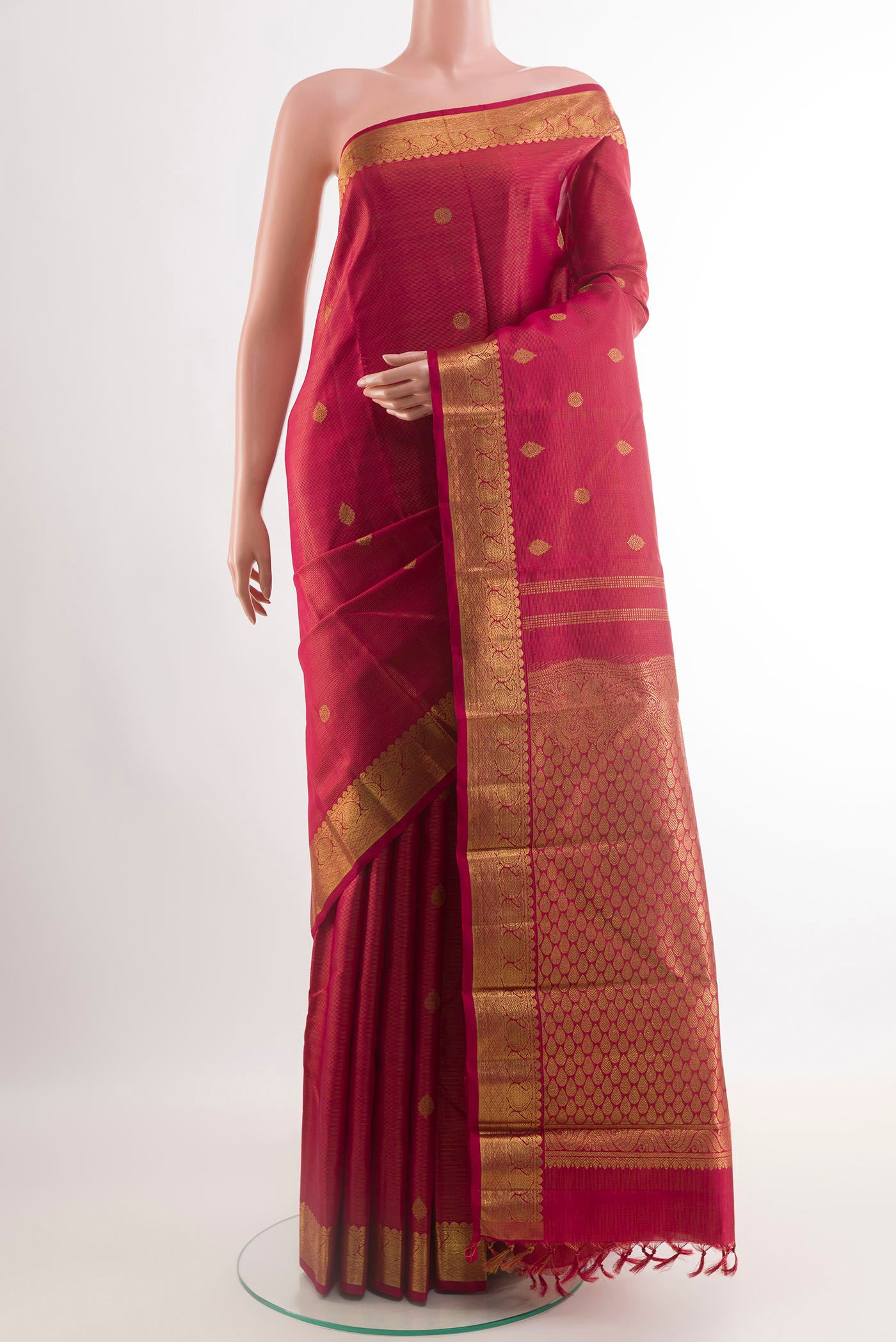 Maroon Kanchipuram Silk Saree with Zari Brocade on the body and Zari Border.  displayed on a mannequin