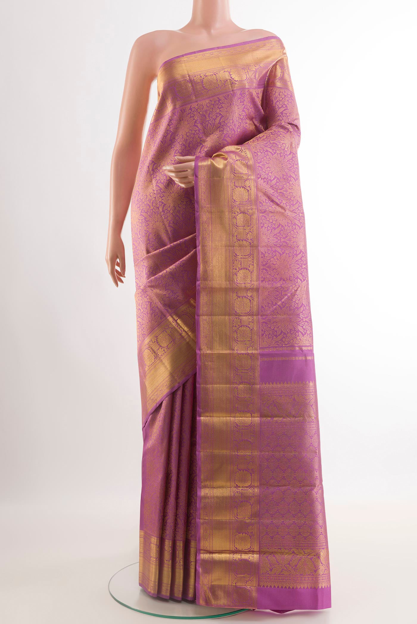 Lavender Kanchipuram Silk Saree with Zari Brocade on the body and Zari Border.  displayed on a mannequin