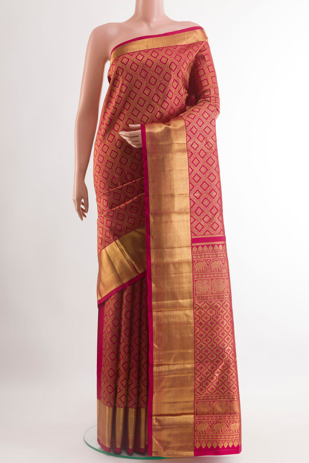 Red Kanchipuram Silk Saree with Zari Brocade on the body and Zari Border.  displayed on a mannequin