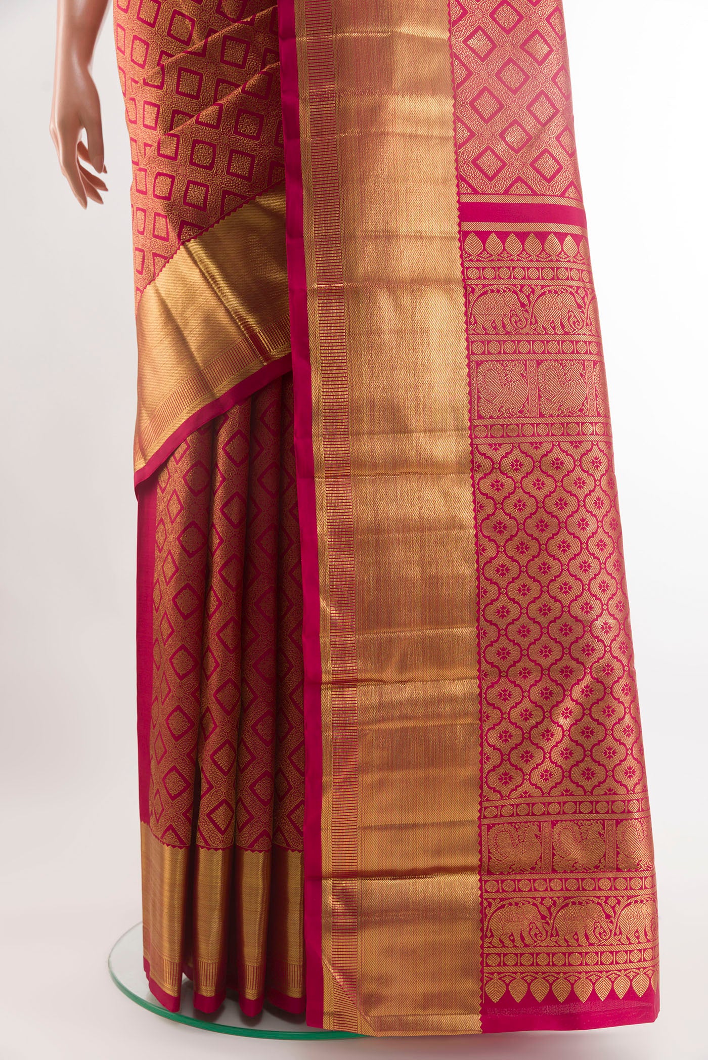 Pleats and pallu of Red Kanchipuram Silk Saree with Zari Brocade on the body and Zari Border. 