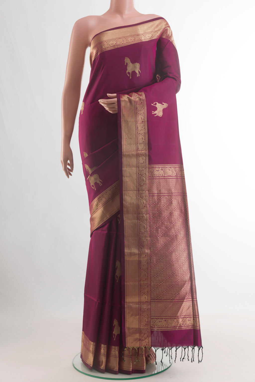 Pure Silk Magenta Soft Saree with Zari Butta on the body and Zari Border.  displayed on a mannequin