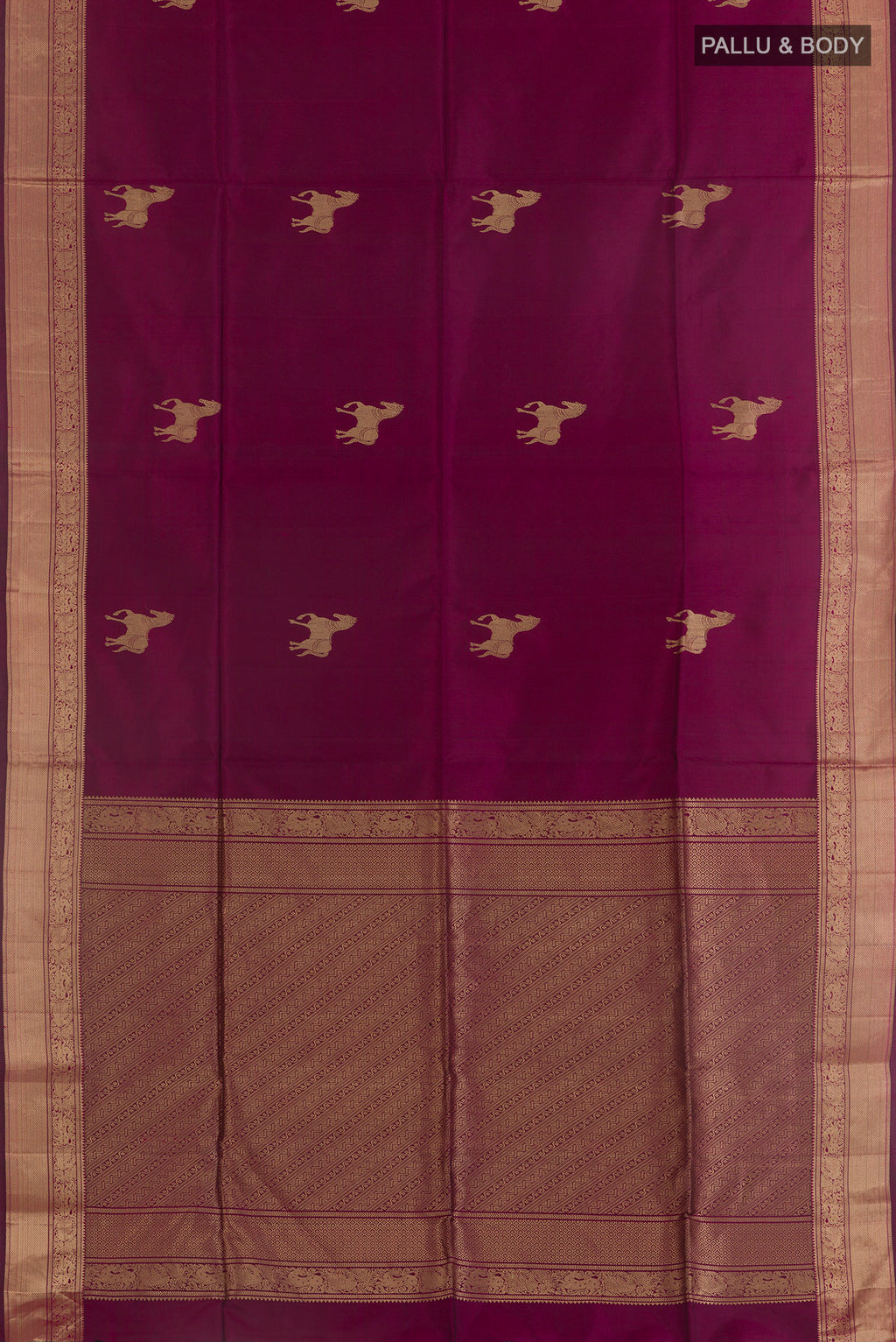 Flat view of Pure Silk Magenta Soft Saree with Zari Butta on the body and Zari Border. 