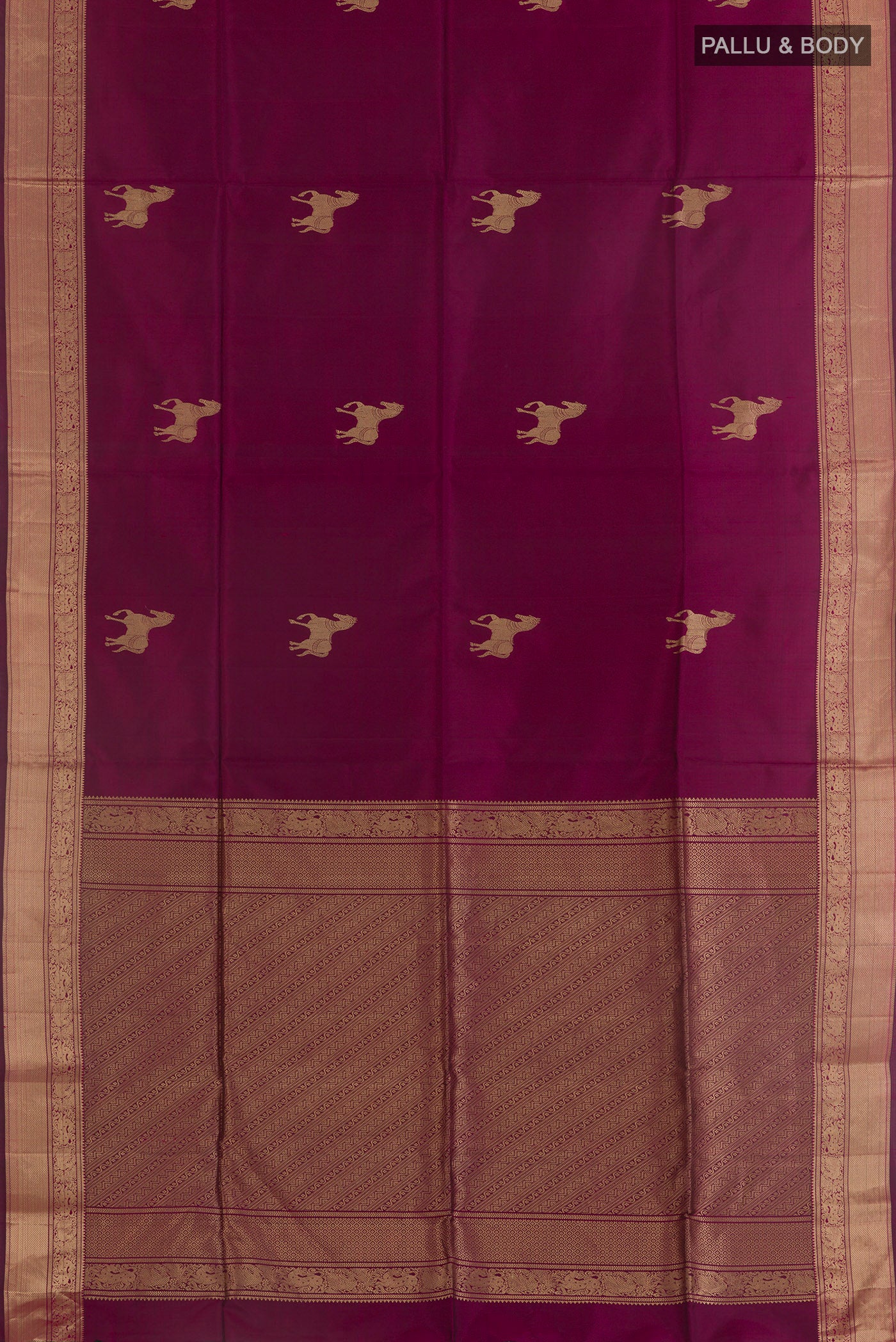 Flat view of Pure Silk Magenta Soft Saree with Zari Butta on the body and Zari Border. 