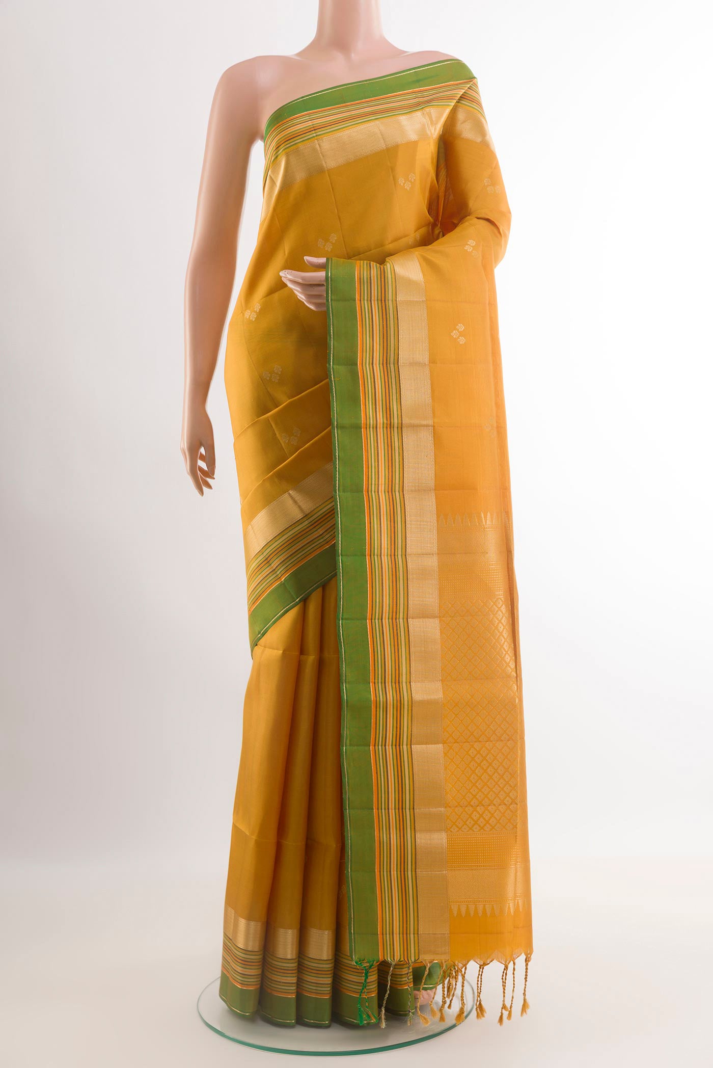 Yellow Soft Silk Saree with Stripes on the body and Zari Border.  displayed on a mannequin