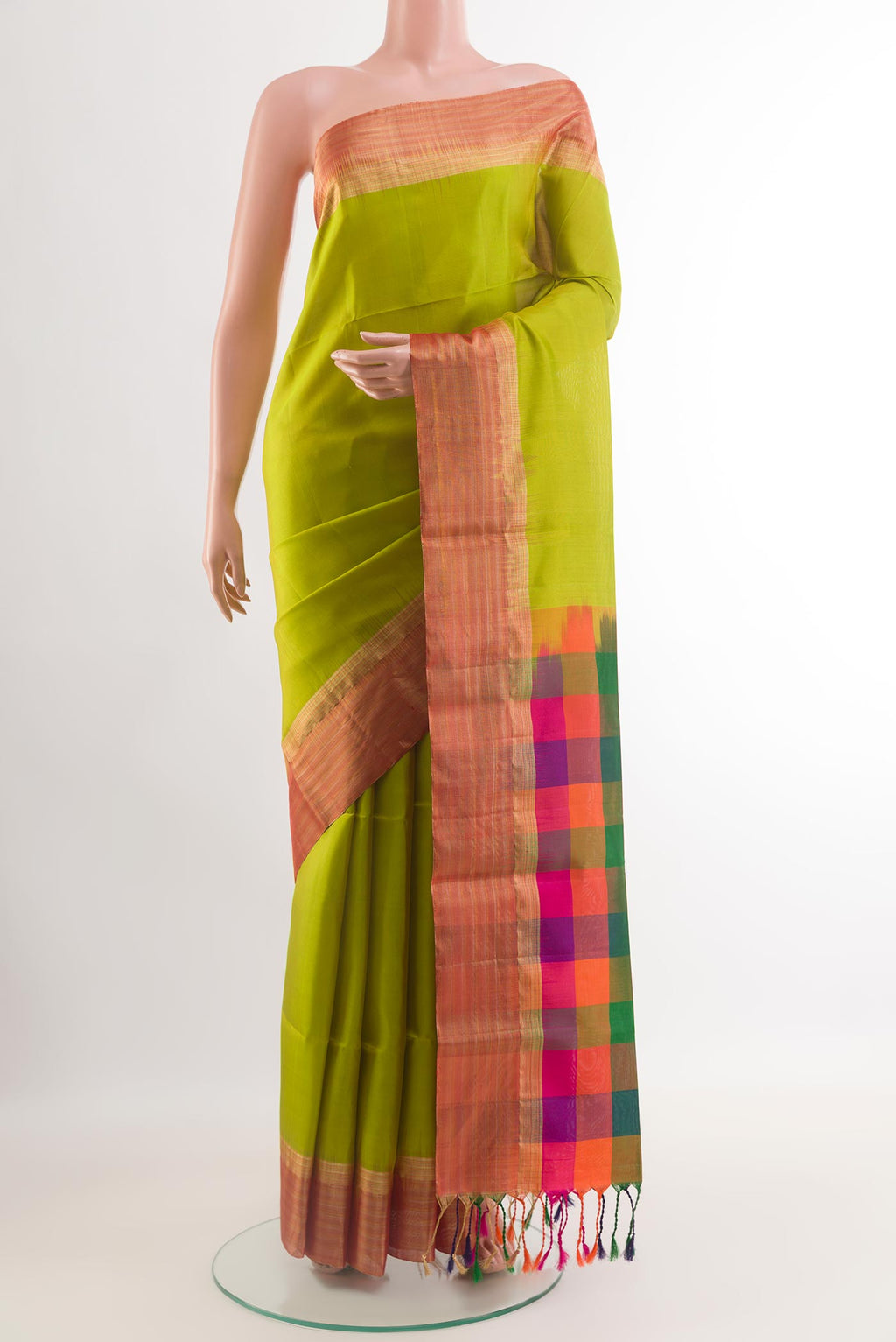 Parrot Green Soft Silk Saree with Plain Body and Zari Border.  displayed on a mannequin