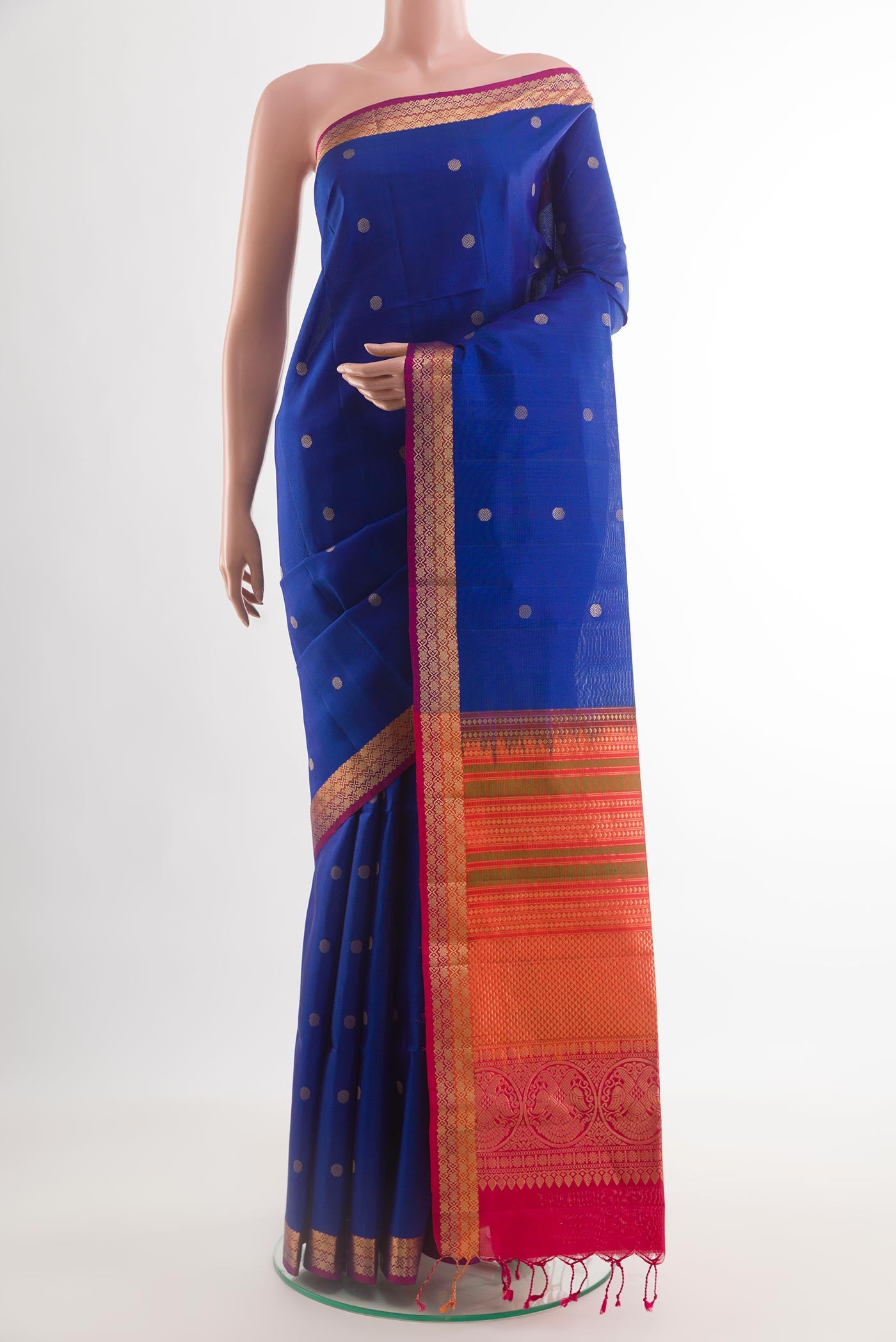 Blue Soft Silk Saree with Zari Butta on the body and Zari Border.  displayed on a mannequin