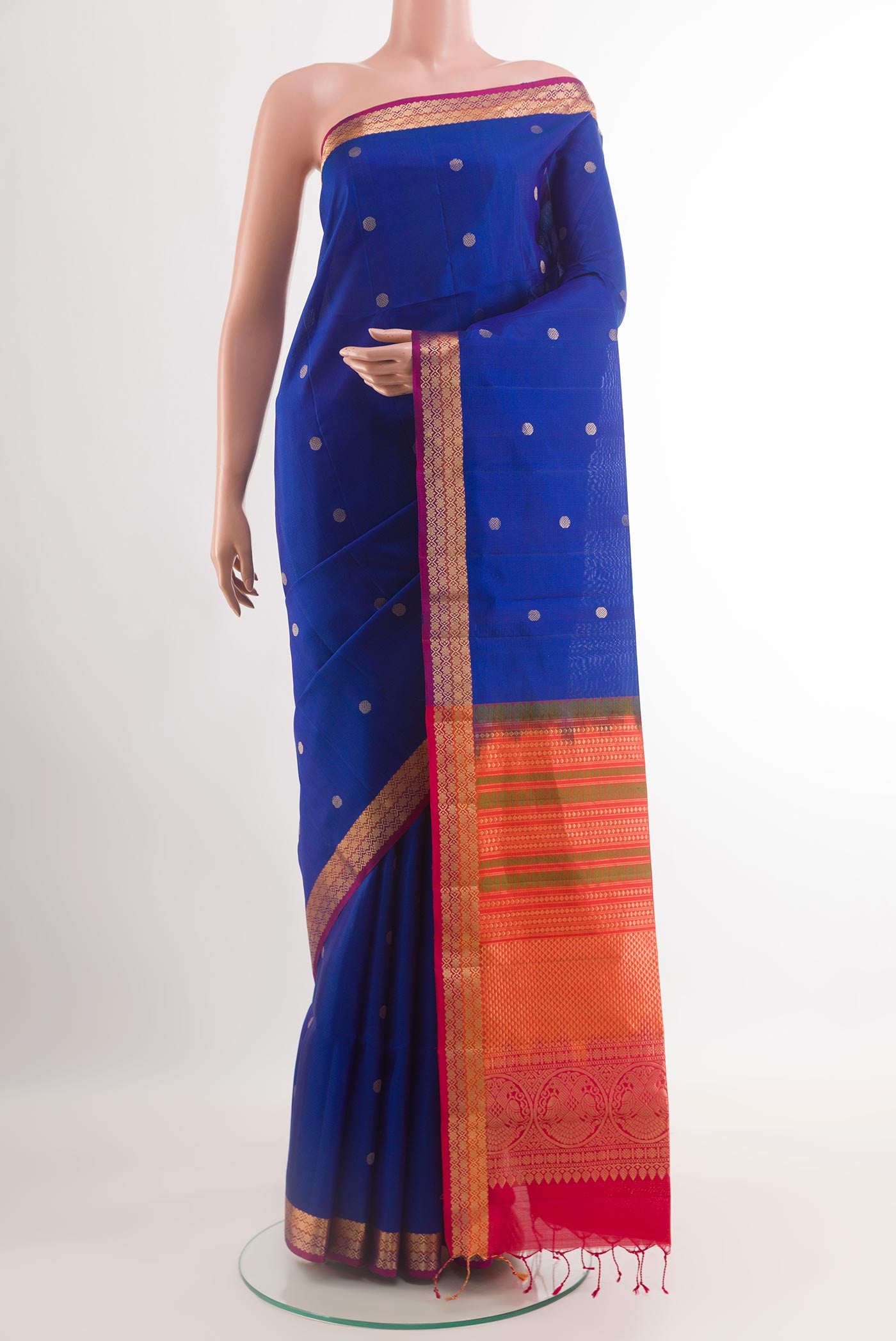Blue Soft Silk Saree with Zari Butta on the body and Zari Border.  displayed on a mannequin