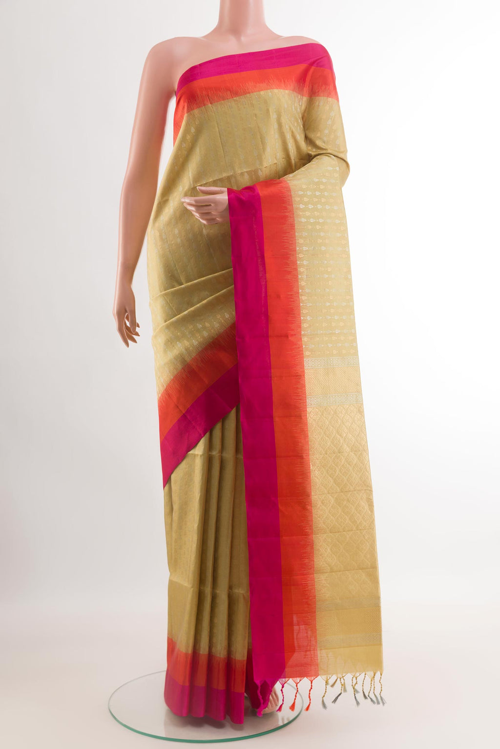 Cream Soft Silk Saree with Zari Butta on the body and Zari Border.  displayed on a mannequin