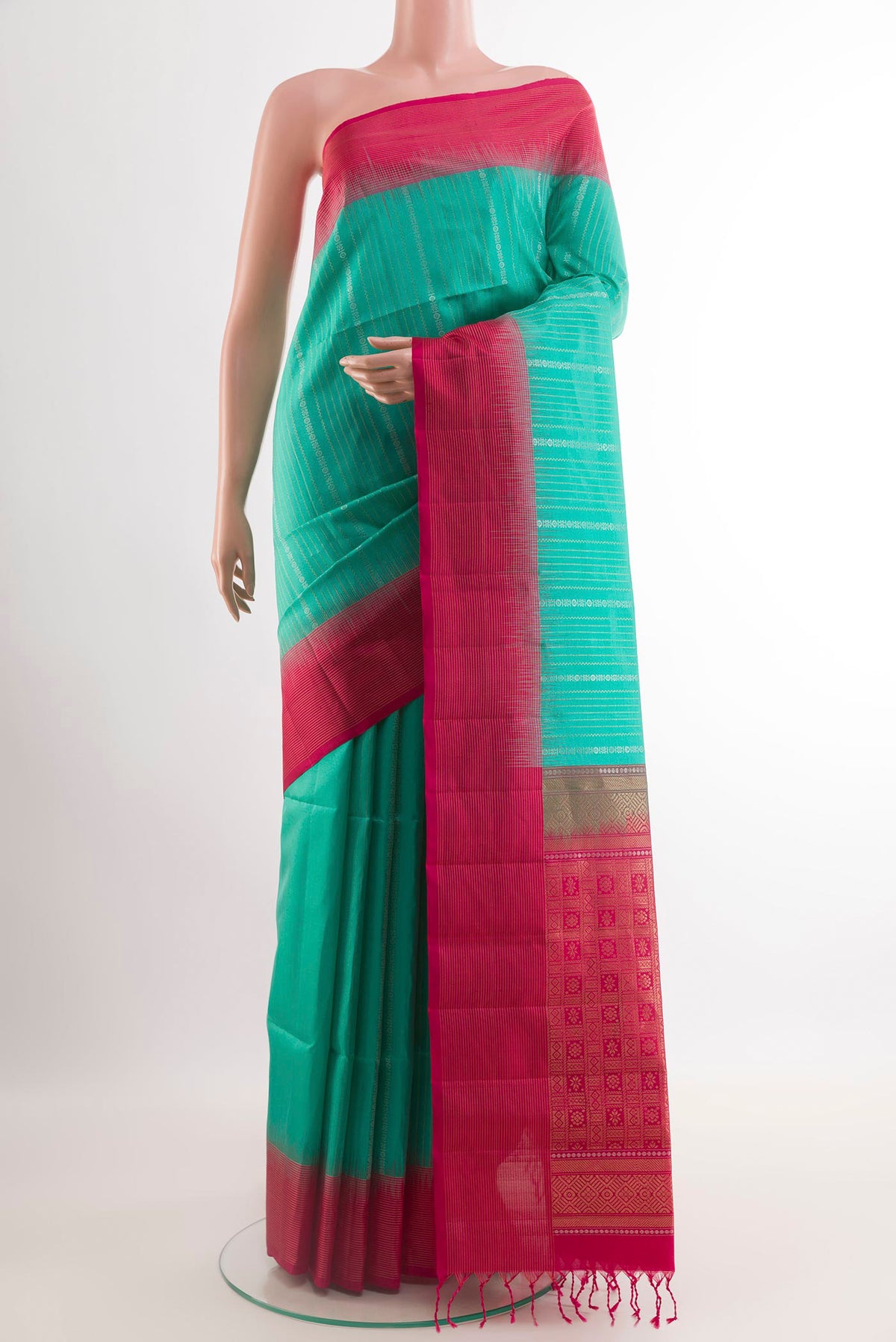 Sea Green Soft Silk Saree with Stripes on the body and Zari Border.  displayed on a mannequin
