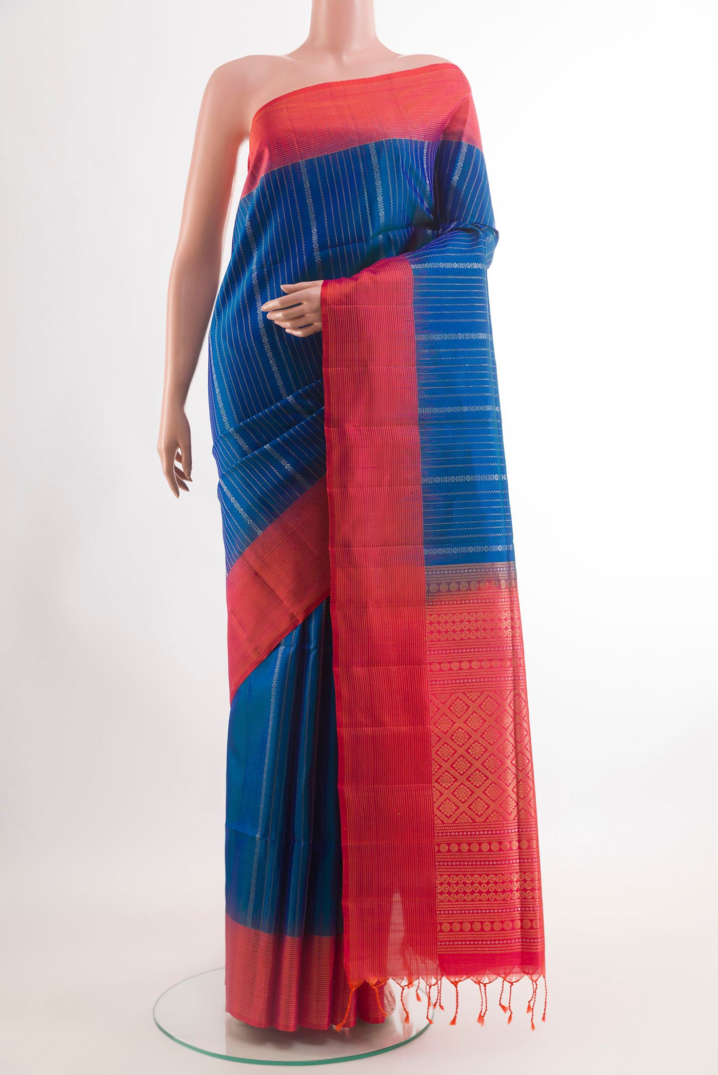 Blue Soft Silk Saree with Stripes on the body and Zari Border.  displayed on a mannequin