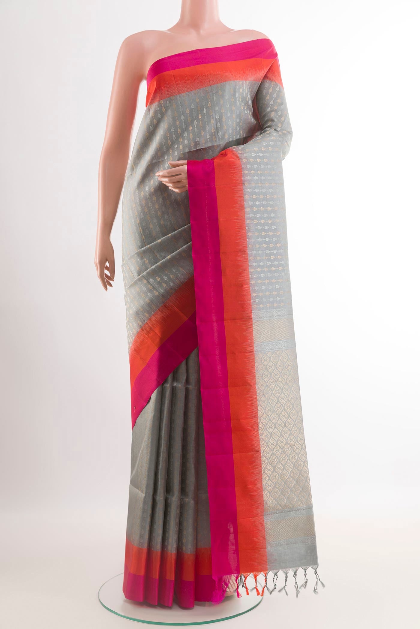 Grey Soft Silk Saree with Stripes on the body and Zari Border.  displayed on a mannequin