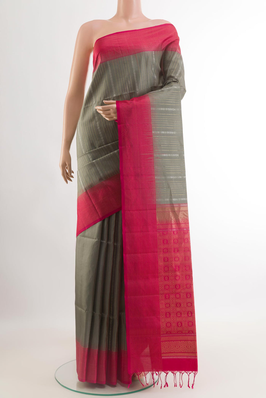 Grey Soft Silk Saree with Stripes on the body and Zari Border.  displayed on a mannequin