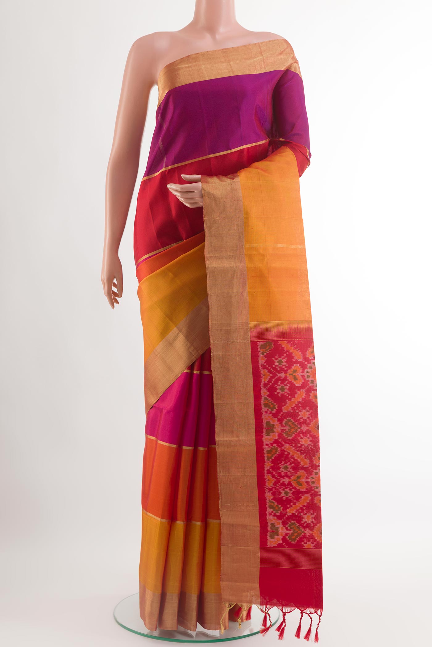 Multi Color Soft Silk Saree with Zari Butta on the body and Zari Border.  displayed on a mannequin
