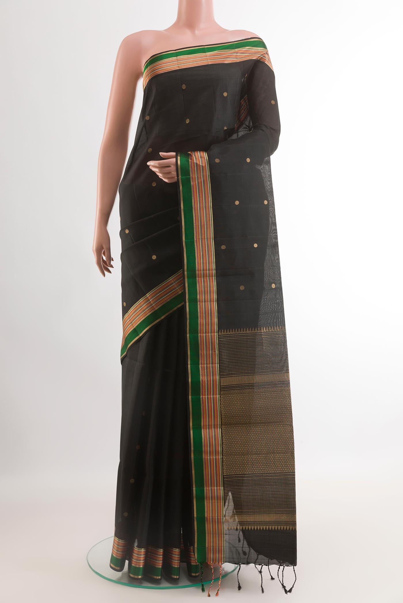 Black Soft Silk Saree with Zari Butta on the body and Zari Border.  displayed on a mannequin