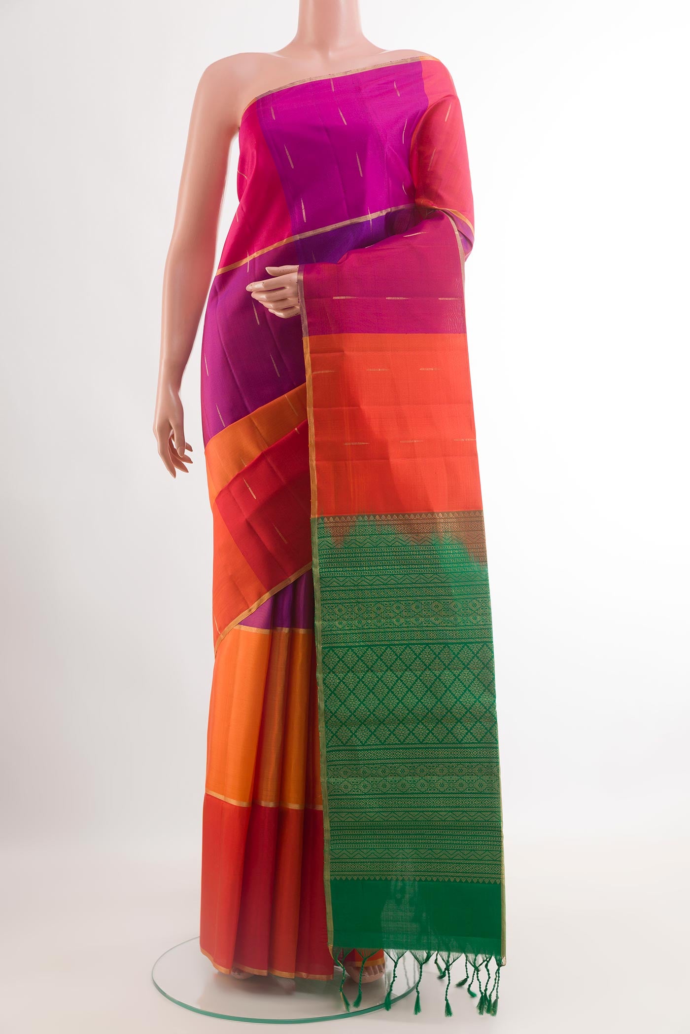 Multi Color Raw Silk Saree with Zari Butta on the body and Zari Border.  displayed on a mannequin