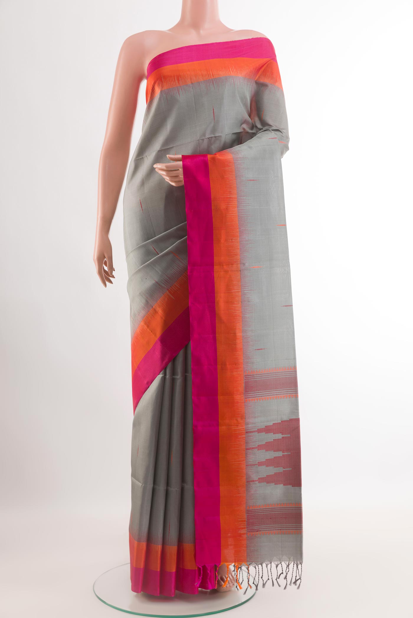 Grey Soft Silk Saree with Thread Butta on the body and Zari Border.  displayed on a mannequin