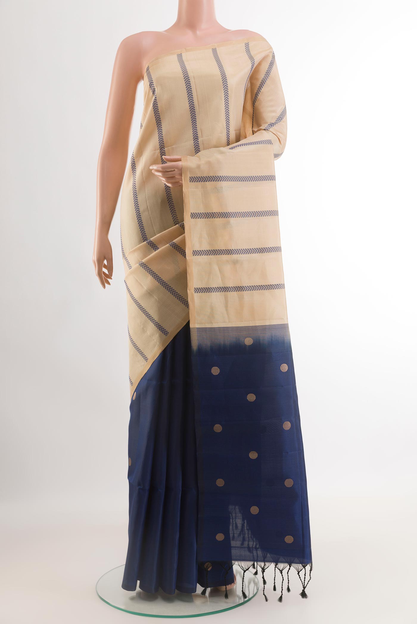Beige Soft Silk Saree with Stripes on the body and Zari Border.  displayed on a mannequin