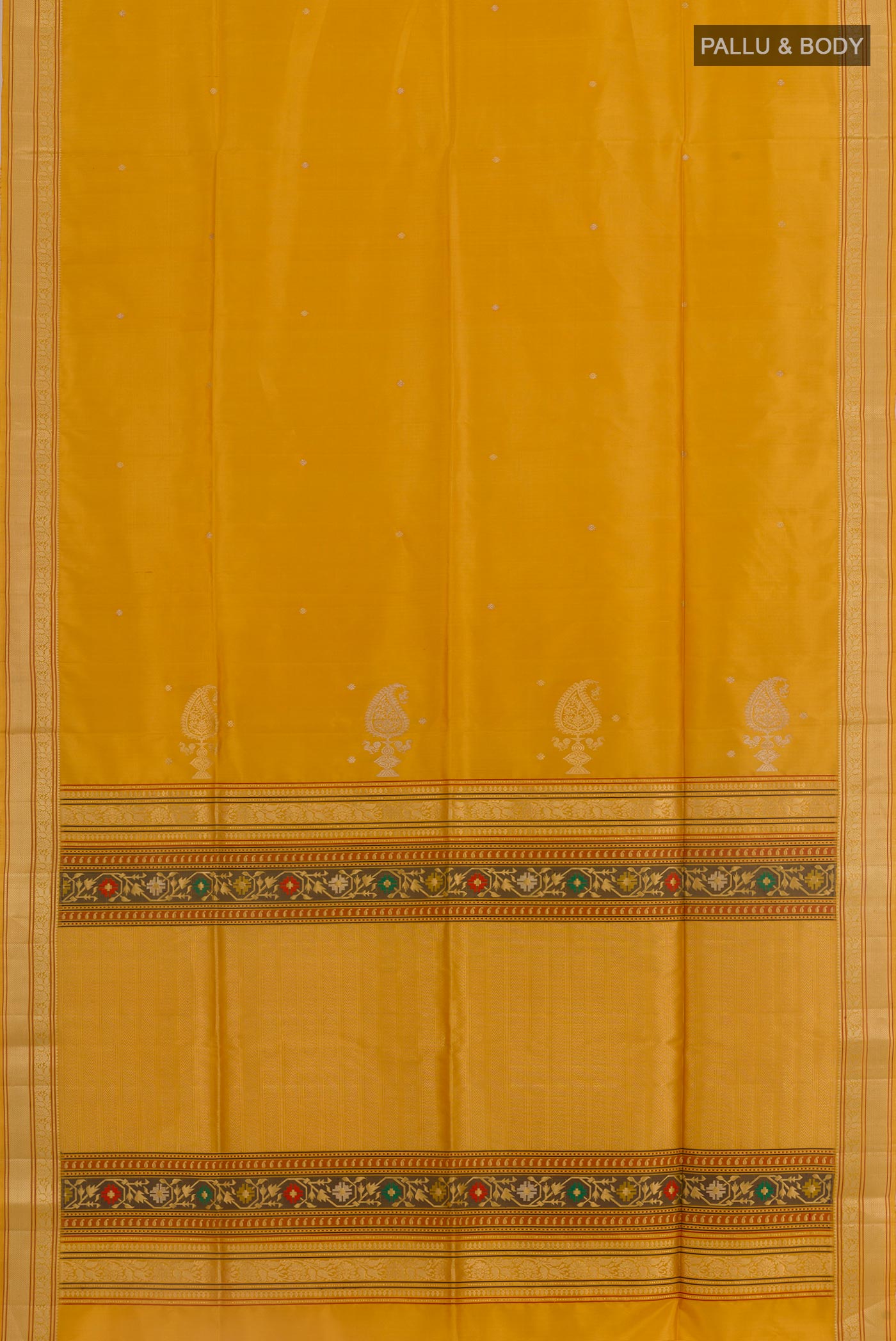 Flat view of Yellow Soft Silk Saree with Zari Butta on the body and Zari Border. 