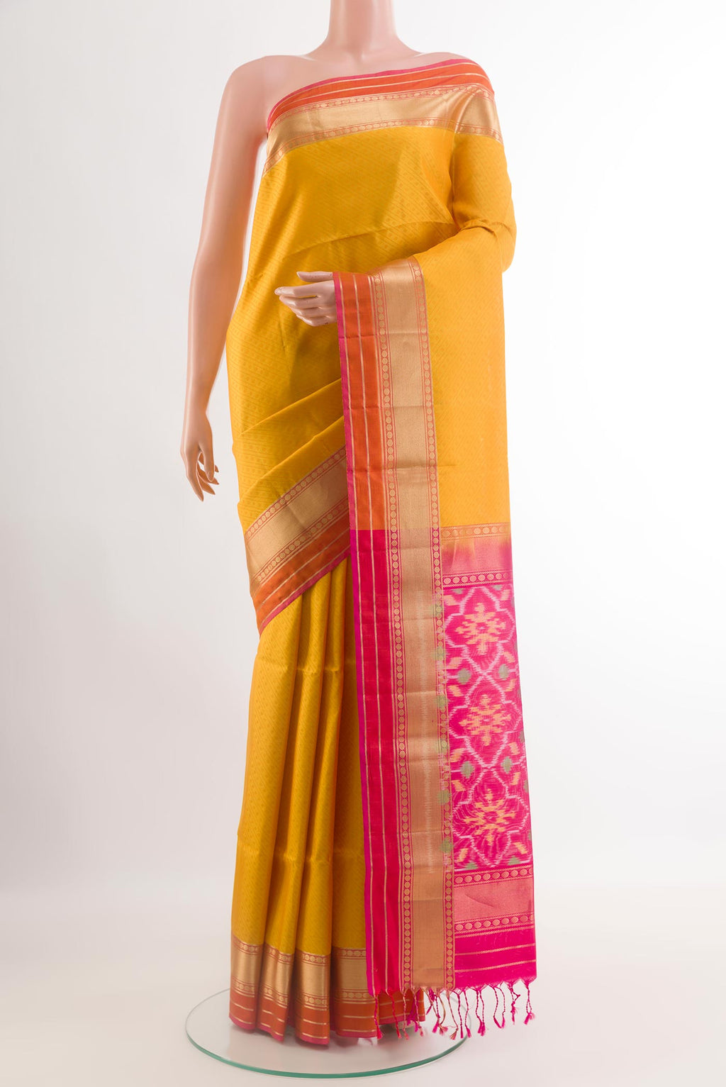 Yellow Soft Silk Saree with Jacquard design on the body and Zari Border.  displayed on a mannequin