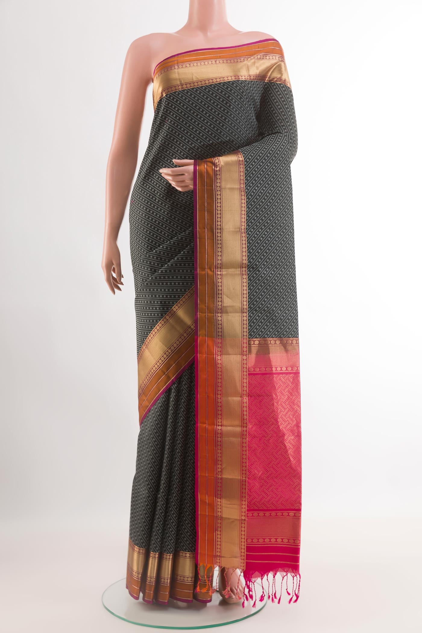 Black Soft Silk Saree with Jacquard design on the body and Zari Border.  displayed on a mannequin