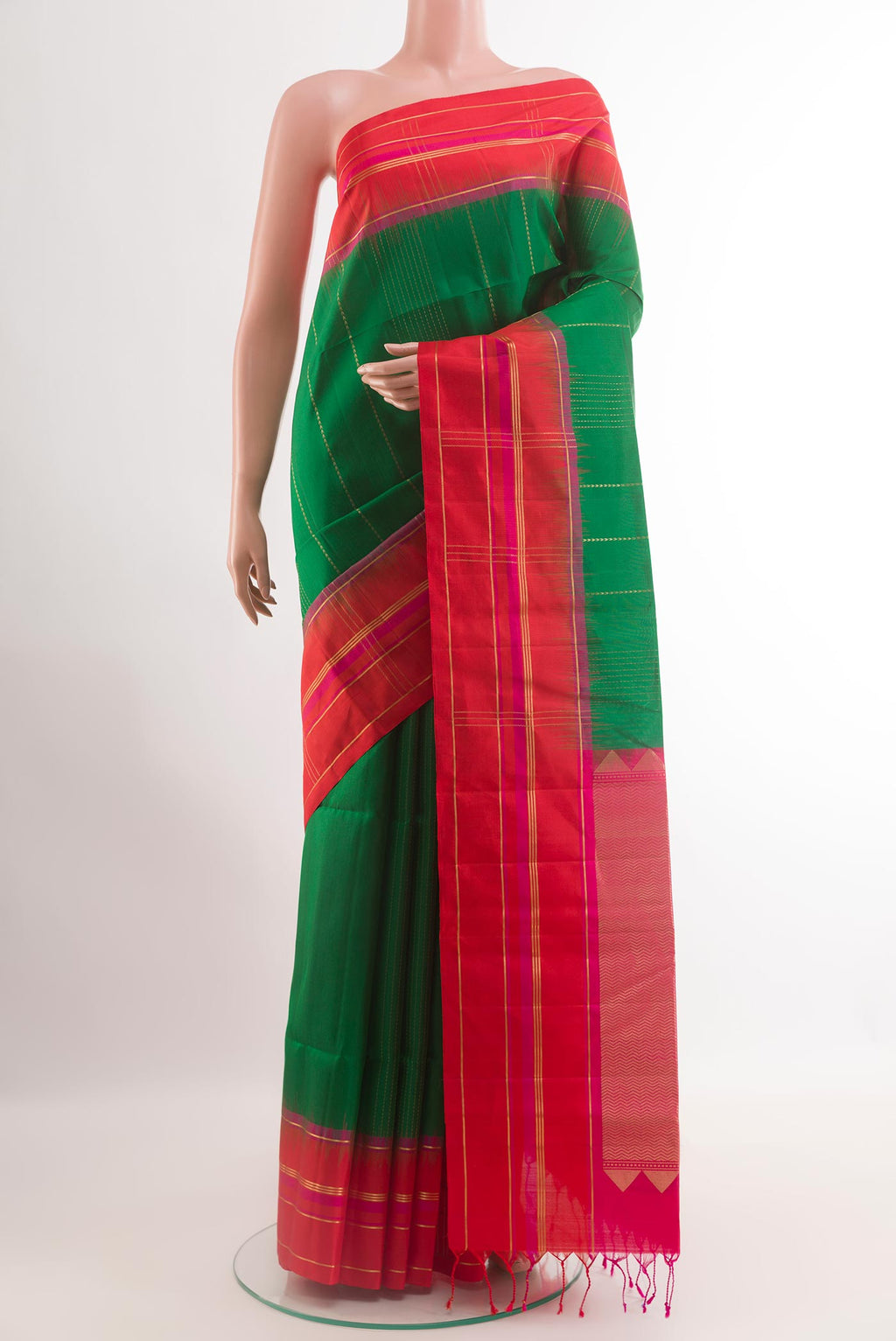 Green Soft Silk Saree with Stripes on the body and Zari Border.  displayed on a mannequin