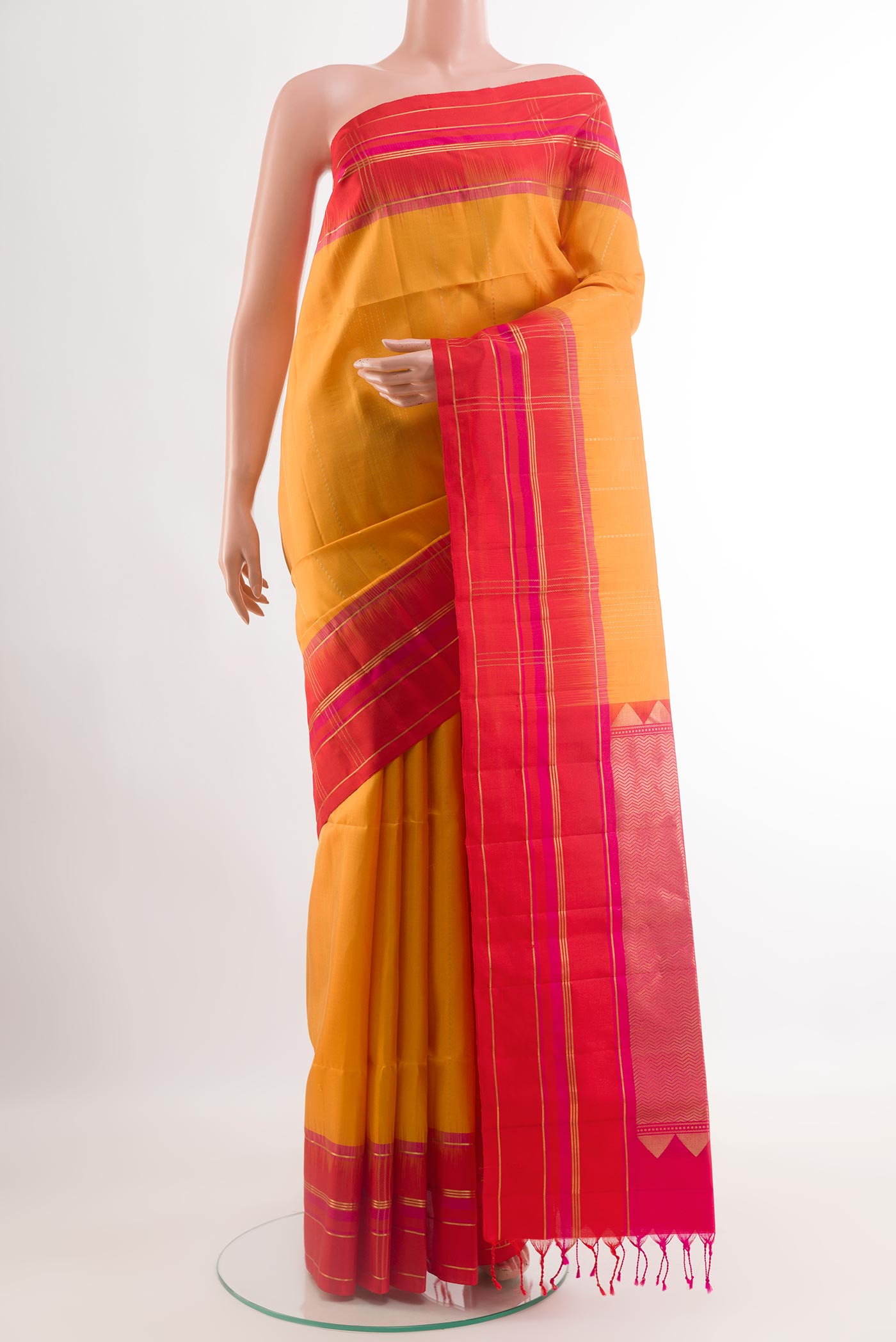 Yellow Soft Silk Saree with Stripes on the body and Zari Border.  displayed on a mannequin