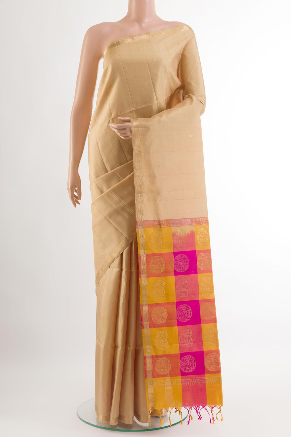 Beige Soft Silk Saree with Zari Butta on the body and Zari Border.  displayed on a mannequin
