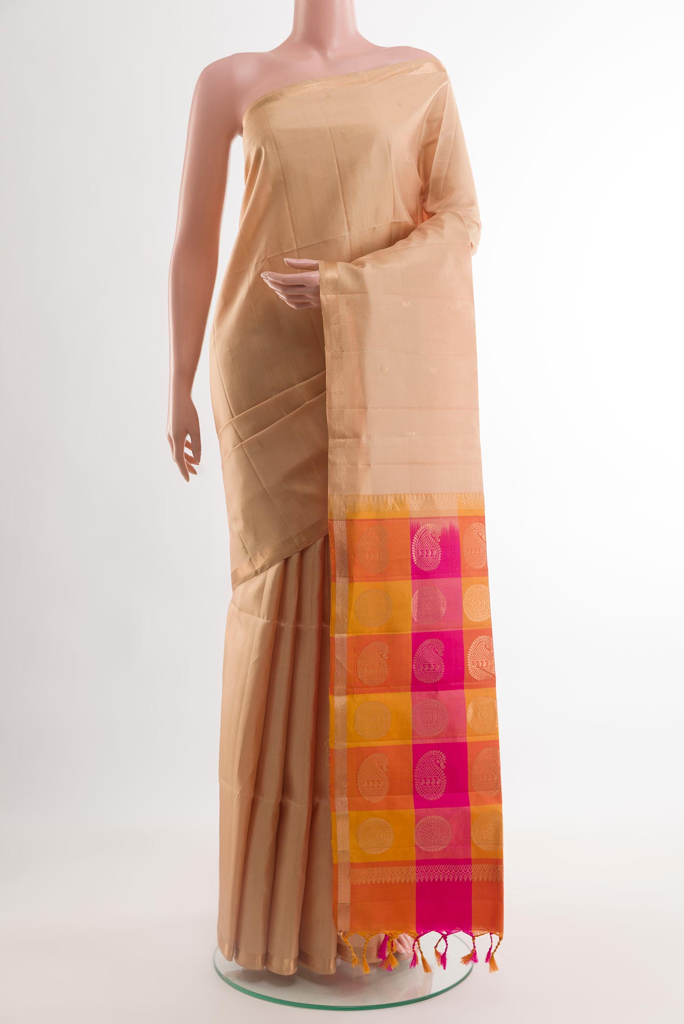 Sandal Soft Silk Saree with Zari Butta on the body and Zari Border.  displayed on a mannequin
