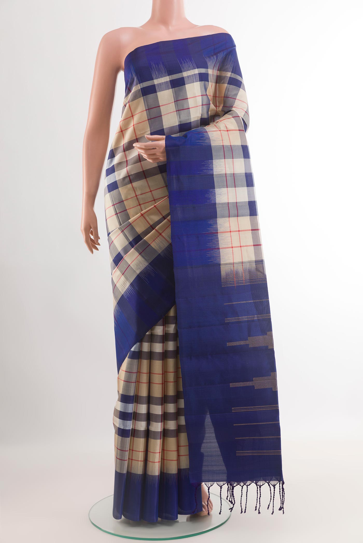 Off White Soft Silk Saree with Checked design on the body and Zari Border.  displayed on a mannequin