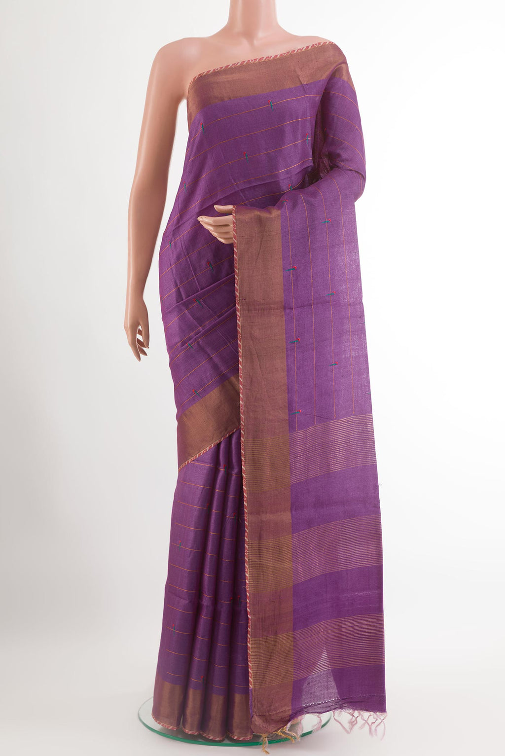 Purple Tussar Saree with Thread Butta on the body and Zari Border.  displayed on a mannequin