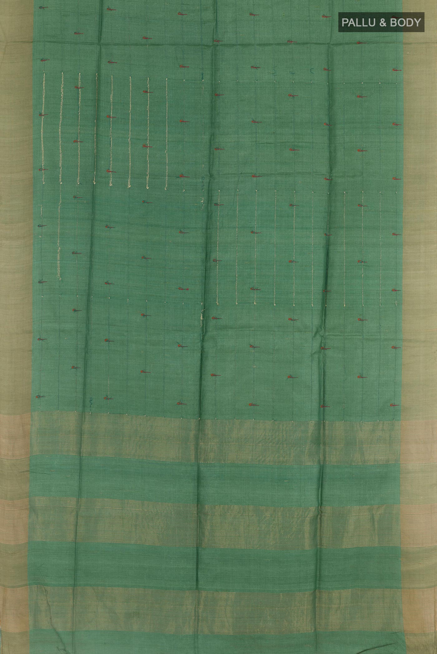 Flat view of Green Tussar Saree with Thread Butta on the body and Zari Border. 