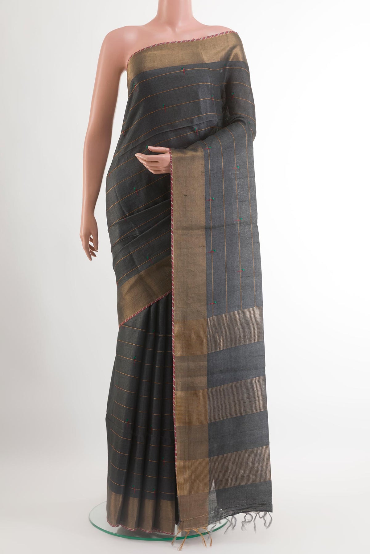 Grey Tussar Saree with Thread Butta on the body and Zari Border.  displayed on a mannequin