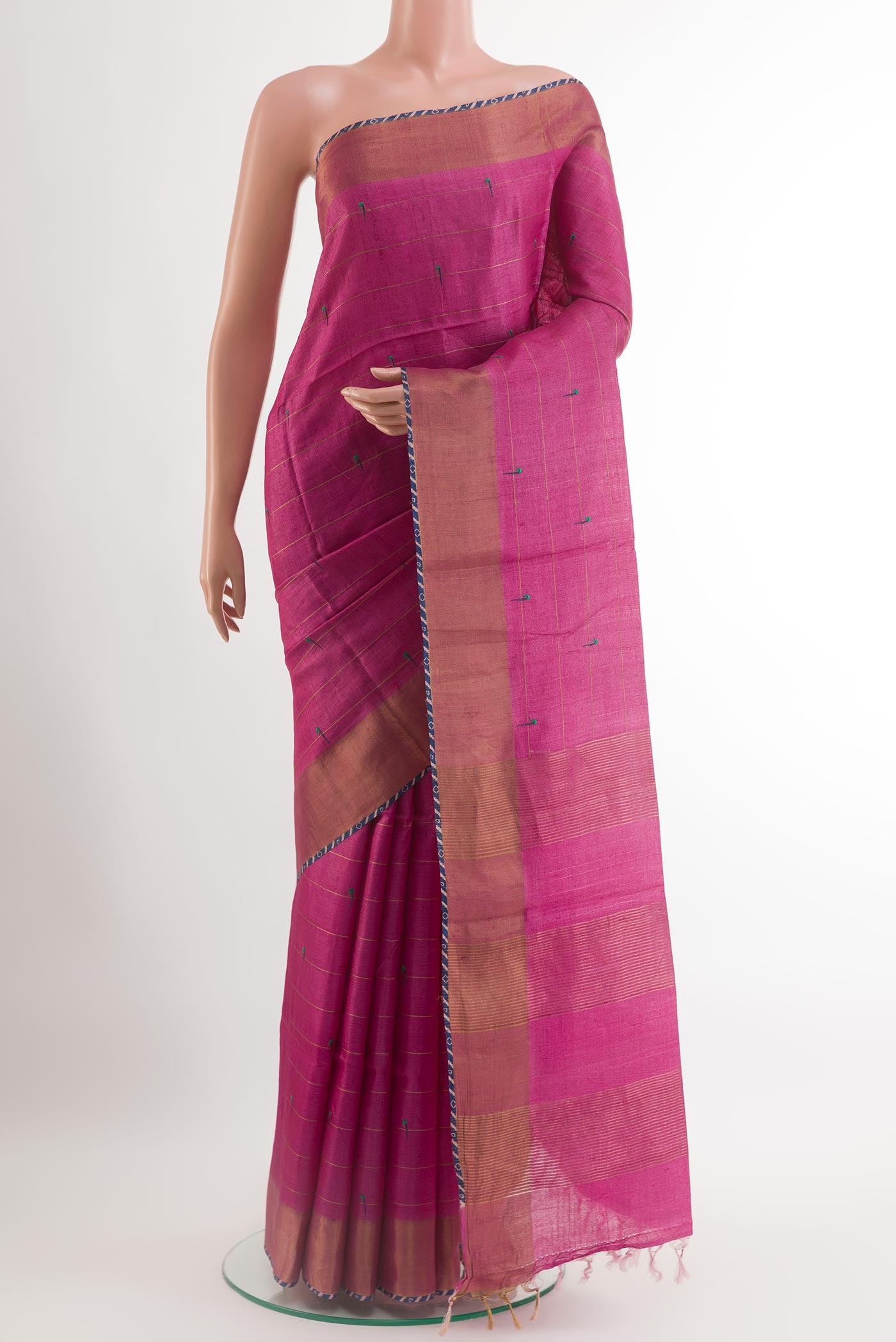 Pink Tussar Saree with Thread Butta on the body and Zari Border.  displayed on a mannequin
