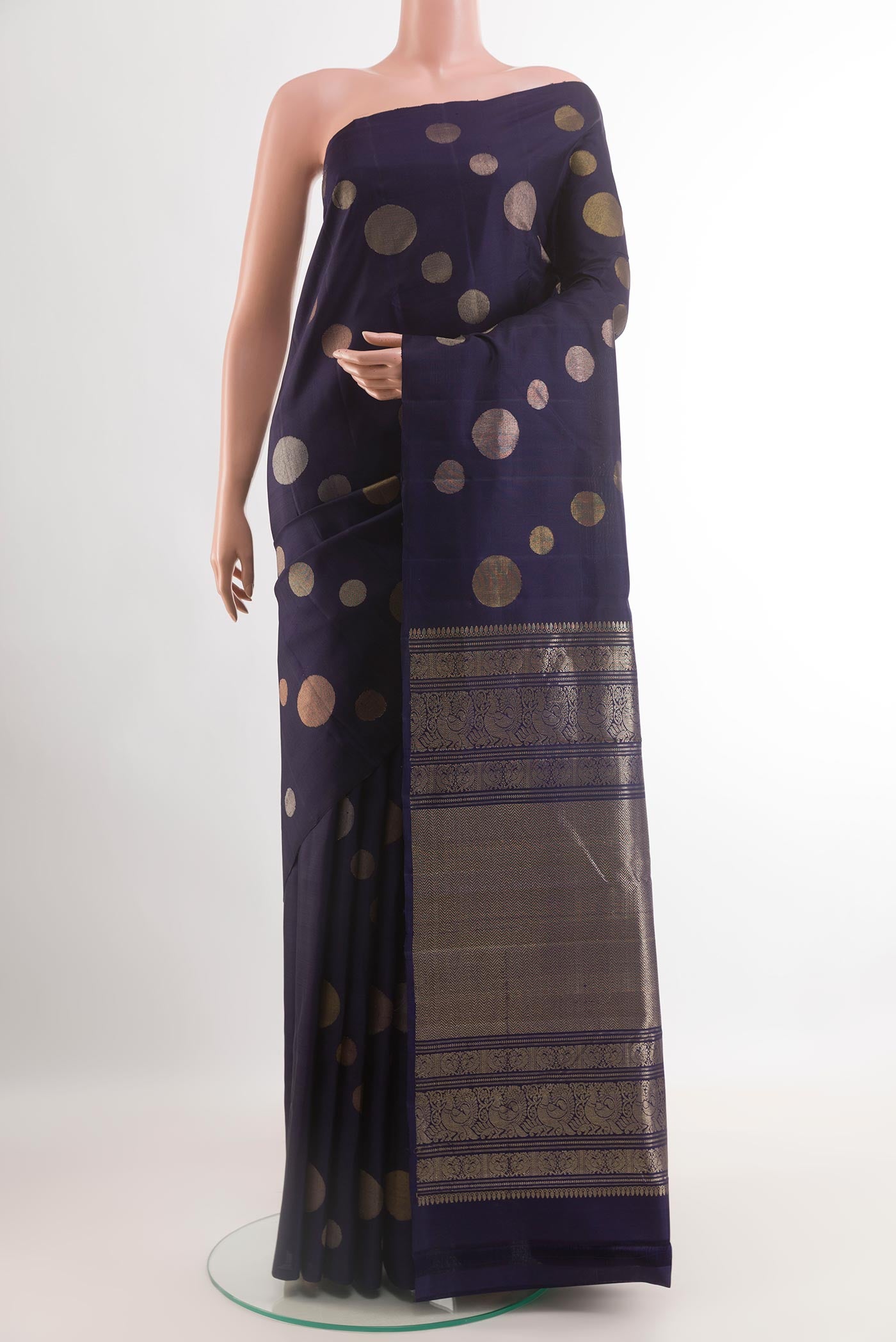 Dark Blue Kanjivaram Silk Saree with Zari Butta on the body and Zari Border.  displayed on a mannequin