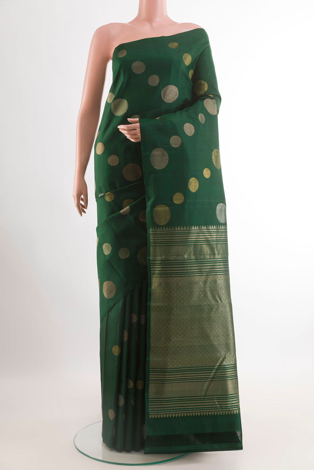 Bottle Green Kanjivaram Silk Saree with Zari Butta on the body and Zari Border.  displayed on a mannequin