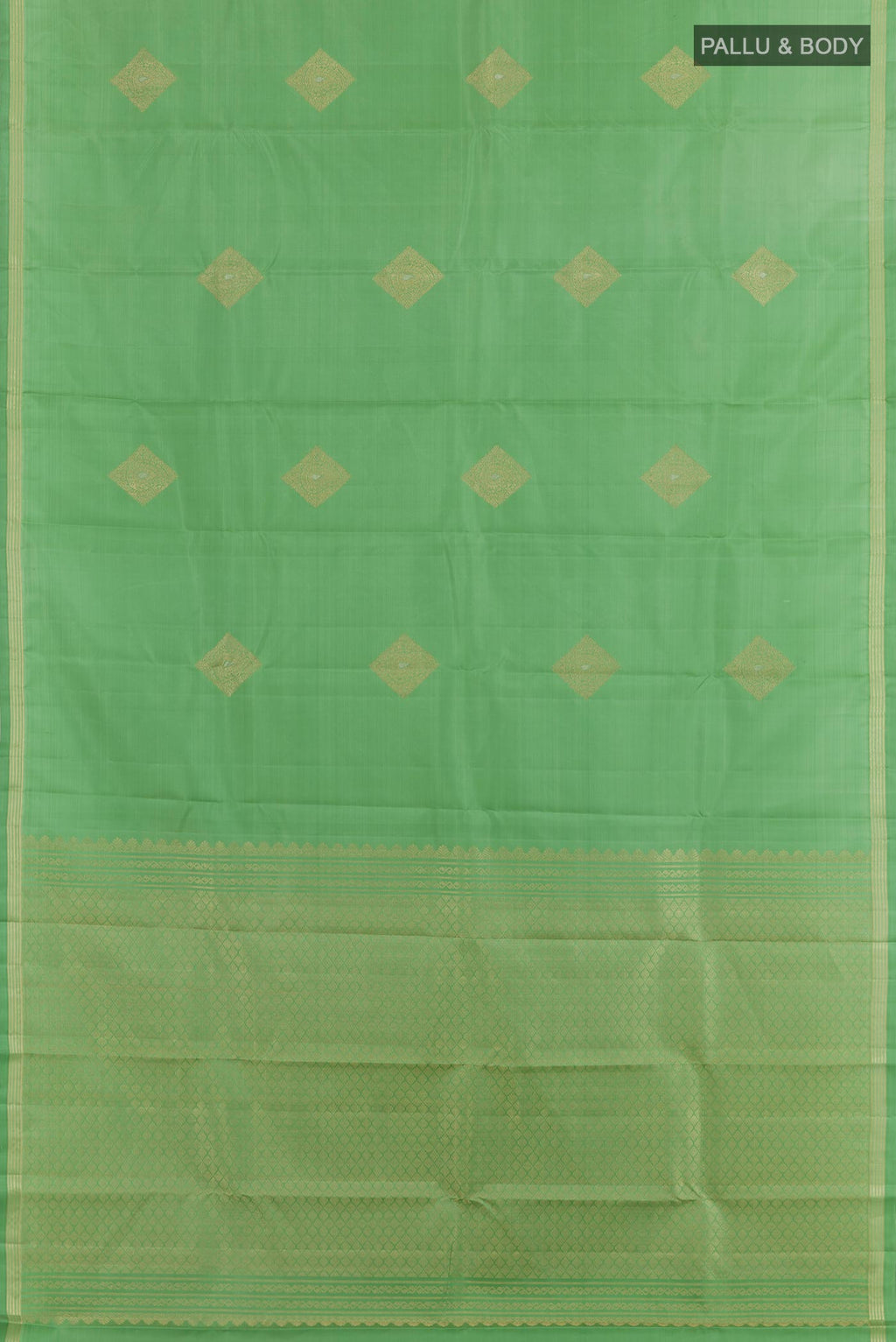 Flat view of Light Green Kanchipuram Silk Saree with Zari Butta on the body and Zari Border. 