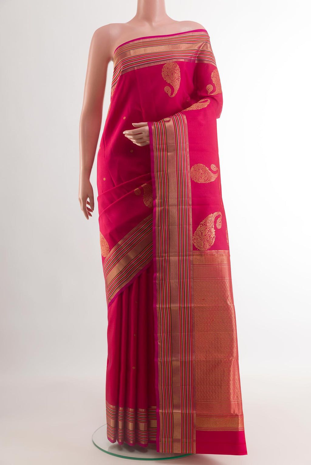 Pink Kanchipuram Silk Saree with Zari Butta on the body and Zari Border.  displayed on a mannequin