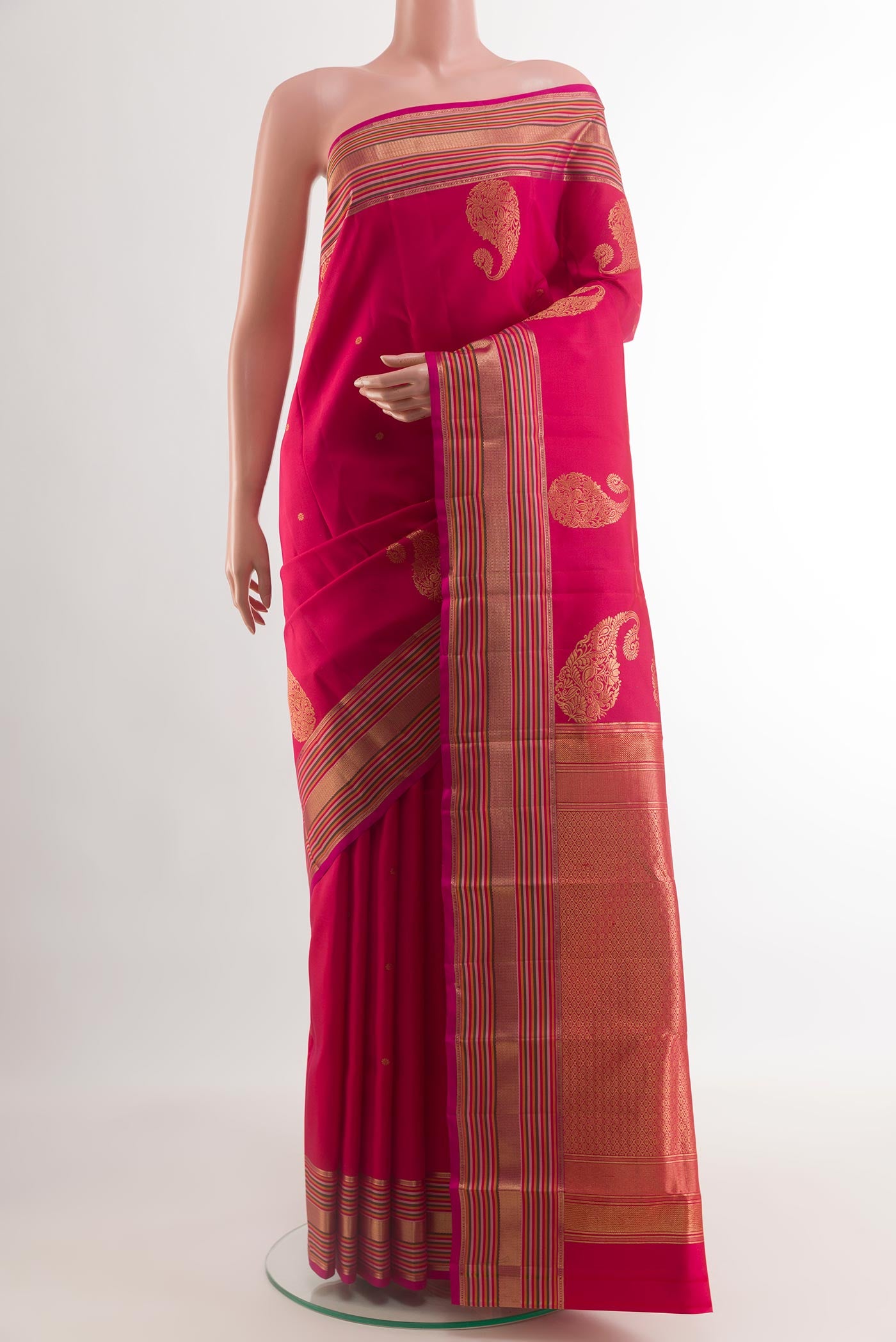 Pink Kanchipuram Silk Saree with Zari Butta on the body and Zari Border.  displayed on a mannequin